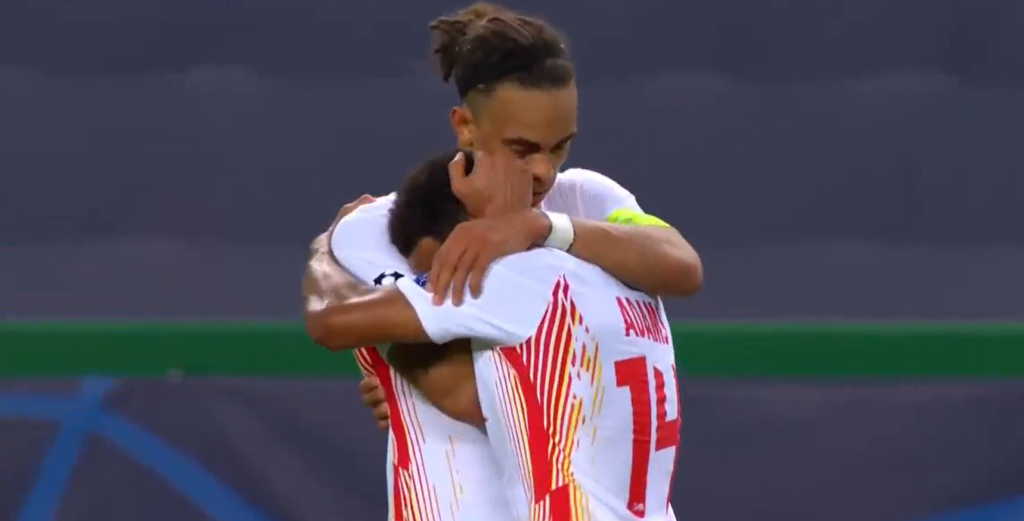 Adams hugging his captain after Leipzig scored their second goal.
