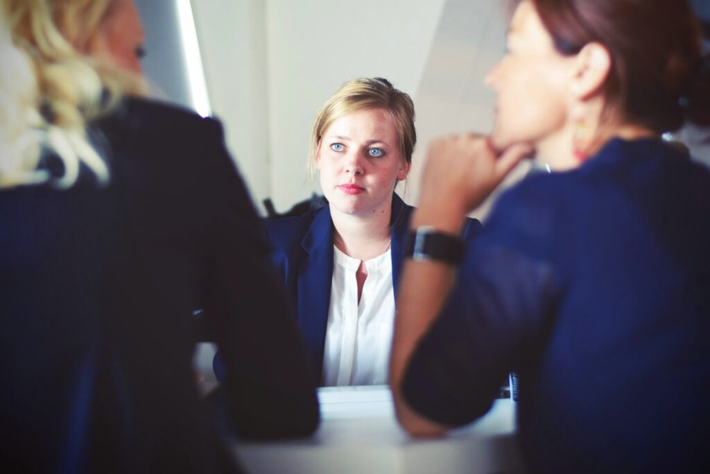 Recruiters interviewing job candidate s